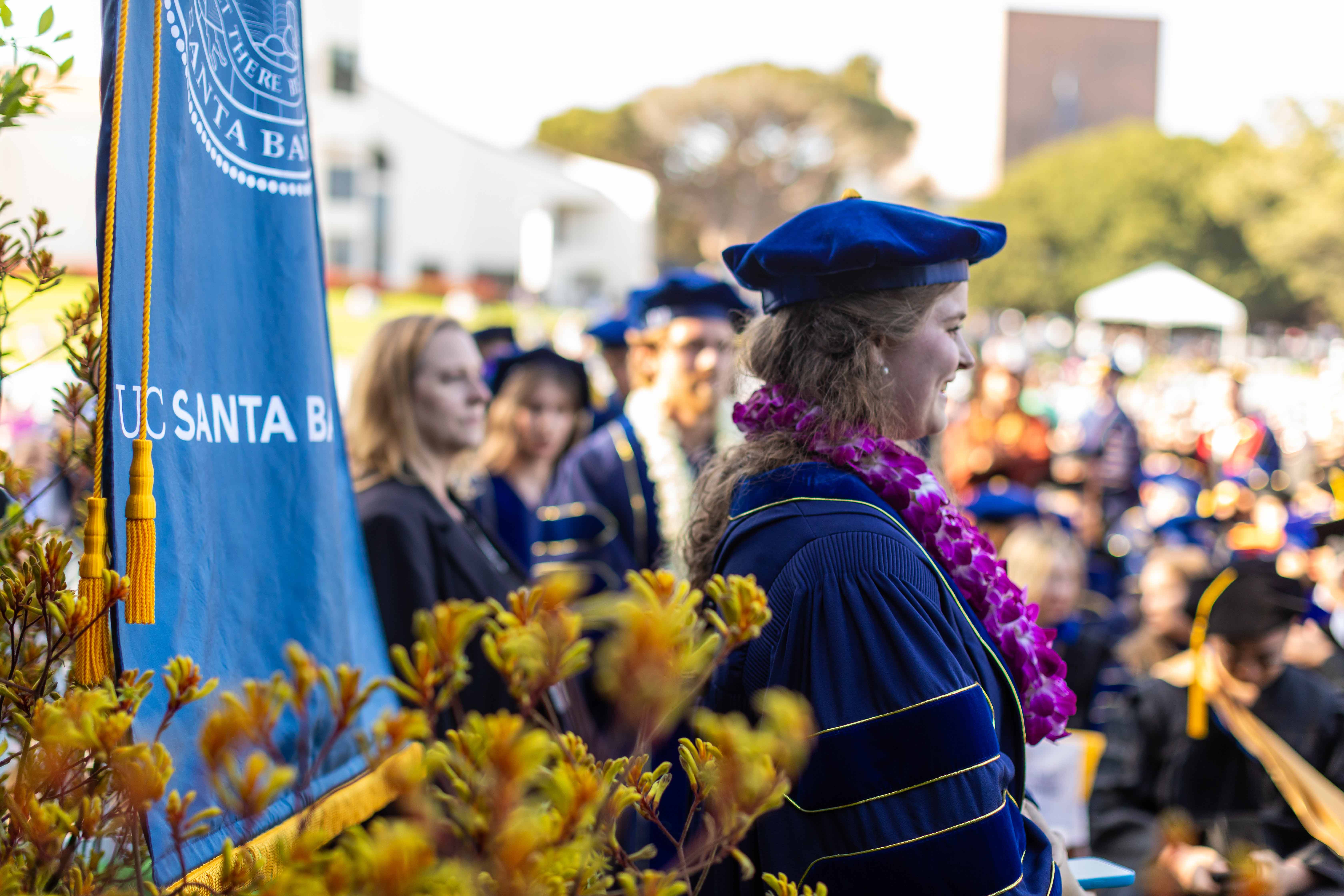 graduate wearing doctoral regalia at ceremony